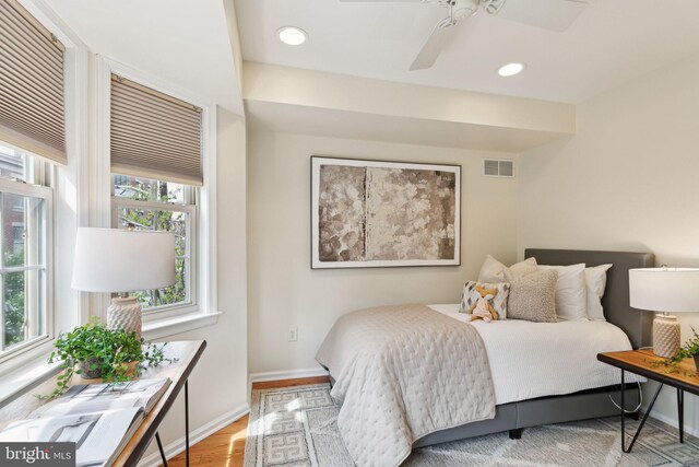 bedroom featuring recessed lighting, wood finished floors, visible vents, a ceiling fan, and baseboards