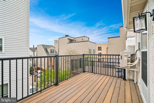 wooden deck featuring a residential view