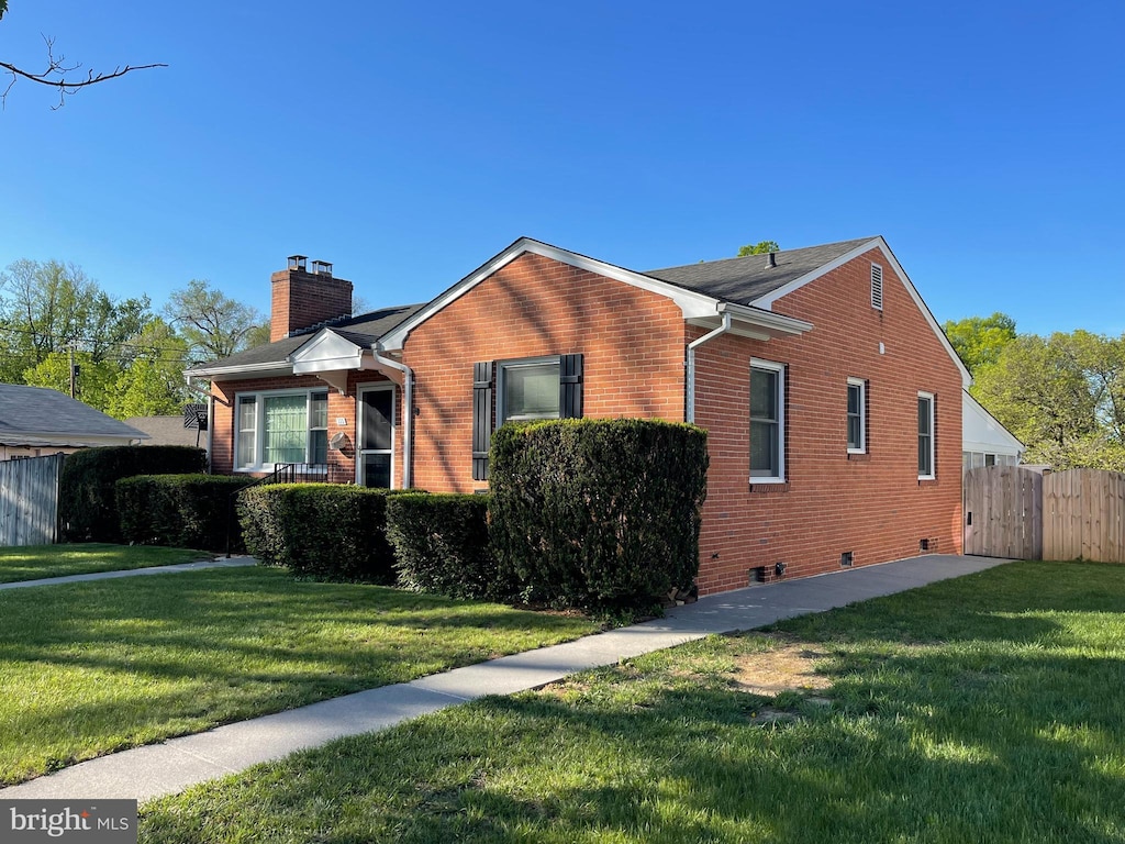 111 Montague Ave, Winchester, VA 22601 - view of front of home featuring a chimney, brick siding, and crawl space