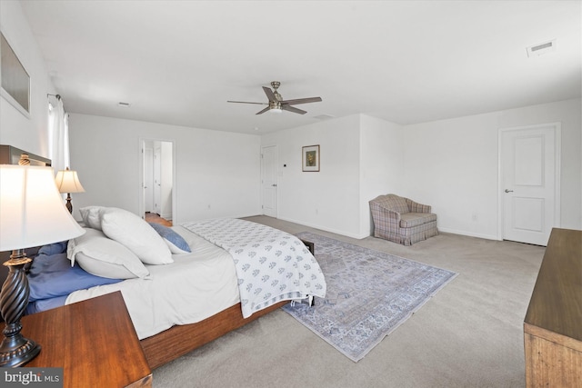 bedroom featuring carpet floors, visible vents, baseboards, and ceiling fan
