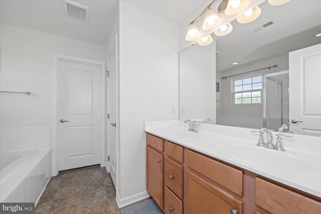 bathroom with visible vents, a sink, and a shower stall