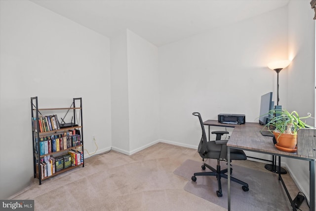 home office with baseboards and carpet