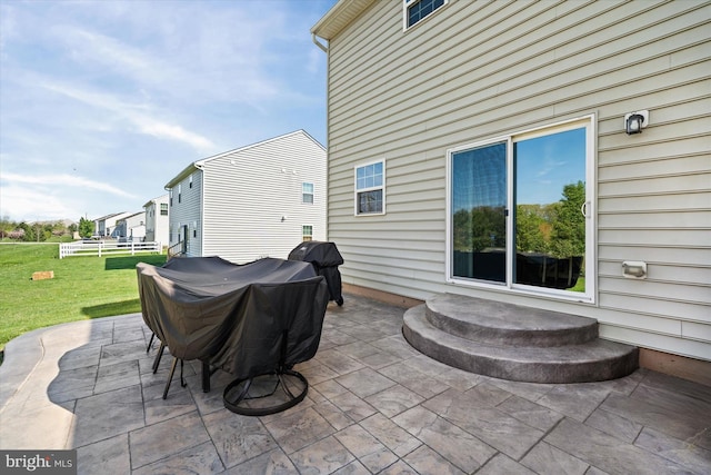 view of patio featuring a grill