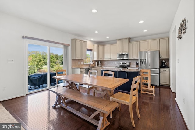 dining space featuring baseboards, recessed lighting, and dark wood-style flooring