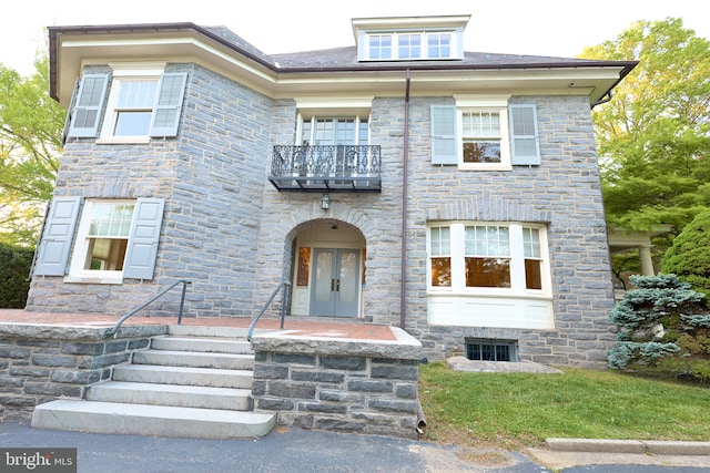 2203 N Grant Ave, Wilmington, DE 19806 - view of front of house with french doors, a balcony, and stone siding