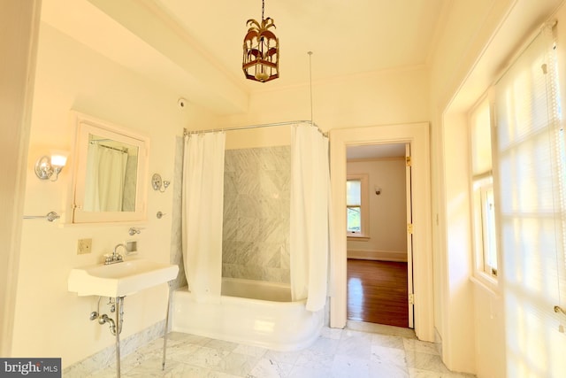 2203 N Grant Ave, Wilmington, DE 19806 - full bathroom with baseboards, marble finish floor, shower / tub combo, and an inviting chandelier