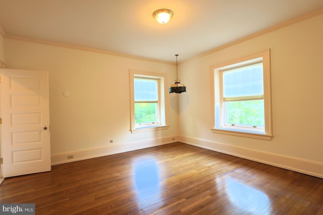 2203 N Grant Ave, Wilmington, DE 19806 - empty room featuring crown molding, baseboards, a healthy amount of sunlight, and dark wood-type flooring