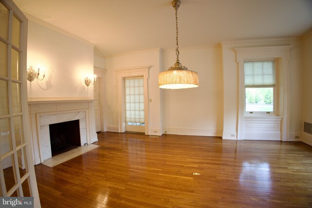 2203 N Grant Ave, Wilmington, DE 19806 - unfurnished living room featuring baseboards, ornamental molding, a premium fireplace, and hardwood / wood-style floors