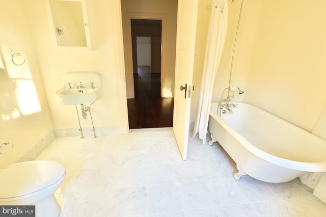 2203 N Grant Ave, Wilmington, DE 19806 - full bathroom featuring a tub to relax in and toilet