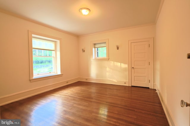 2203 N Grant Ave, Wilmington, DE 19806 - unfurnished room with dark wood-style flooring, baseboards, and ornamental molding