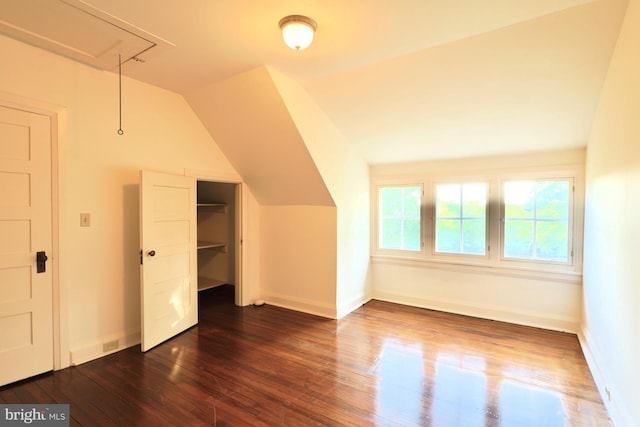 2203 N Grant Ave, Wilmington, DE 19806 - bonus room featuring vaulted ceiling, baseboards, attic access, and dark wood-type flooring