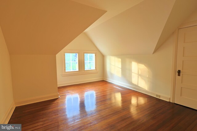 2203 N Grant Ave, Wilmington, DE 19806 - additional living space featuring baseboards, vaulted ceiling, and wood finished floors