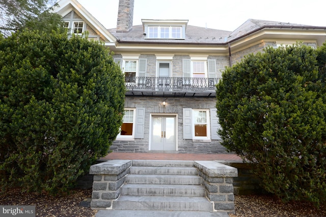 2203 N Grant Ave, Wilmington, DE 19806 - view of front of property with stone siding, french doors, and a chimney