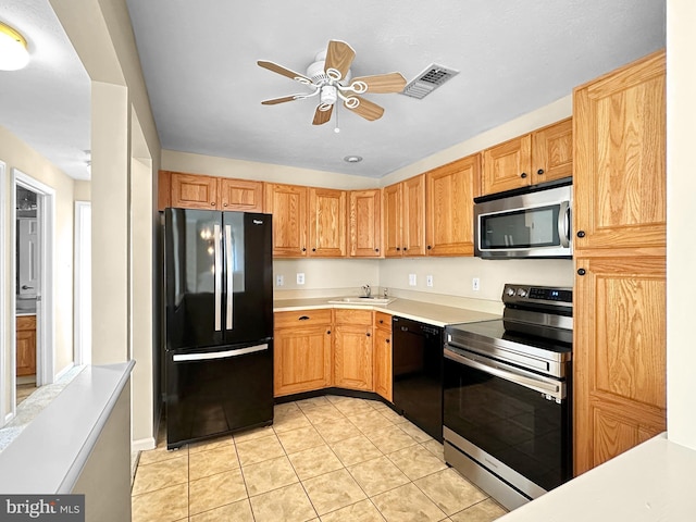 2002 Staghorn Dr, Mount Laurel, NJ 08054 - kitchen featuring a sink, ceiling fan, visible vents, black appliances, and light tile patterned flooring