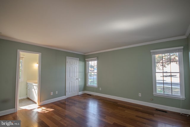 907 Riverside Rd, Salisbury, MD 21801 - unfurnished bedroom with baseboards, ornamental molding, dark wood finished floors, and visible vents