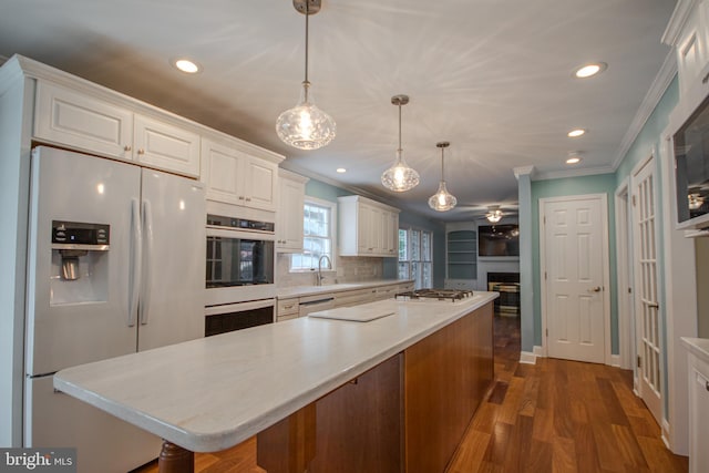 907 Riverside Rd, Salisbury, MD 21801 - kitchen featuring white appliances, recessed lighting, white cabinets, and ornamental molding