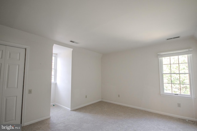 907 Riverside Rd, Salisbury, MD 21801 - unfurnished room featuring a healthy amount of sunlight, light carpet, and visible vents