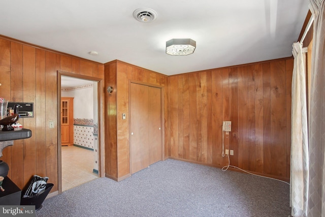 5537 Eldorado Sharptown Rd, Rhodesdale, MD 21659 - unfurnished bedroom featuring wooden walls, light colored carpet, and ornamental molding