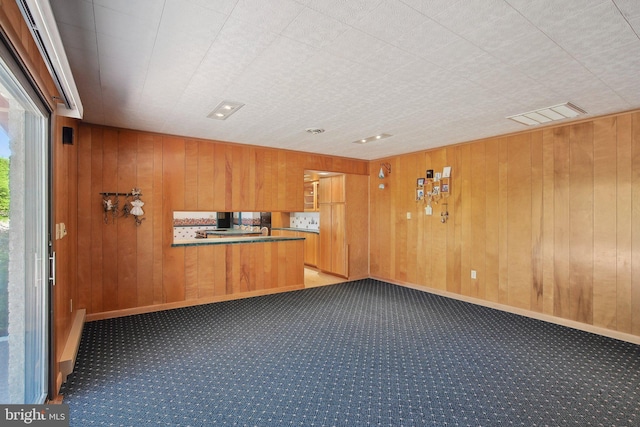 5537 Eldorado Sharptown Rd, Rhodesdale, MD 21659 - kitchen with carpet, wood walls, brown cabinetry, modern cabinets, and baseboards