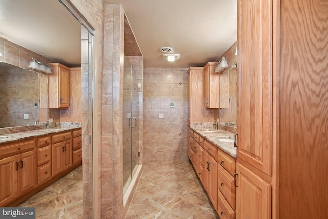 5537 Eldorado Sharptown Rd, Rhodesdale, MD 21659 - bathroom with a stall shower, double vanity, and tile walls