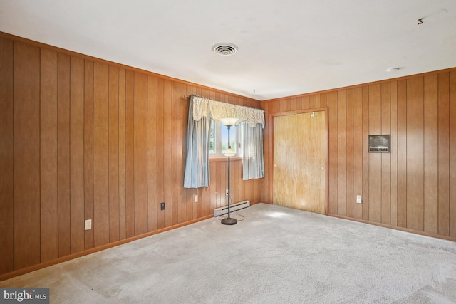 5537 Eldorado Sharptown Rd, Rhodesdale, MD 21659 - spare room featuring a baseboard heating unit, carpet, and wooden walls