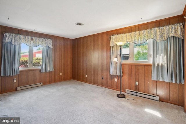 5537 Eldorado Sharptown Rd, Rhodesdale, MD 21659 - spare room featuring a baseboard radiator, baseboard heating, plenty of natural light, wooden walls, and carpet flooring