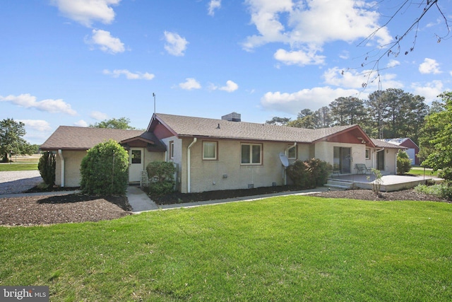 5537 Eldorado Sharptown Rd, Rhodesdale, MD 21659 - view of front of house with a front yard, a chimney, and brick siding