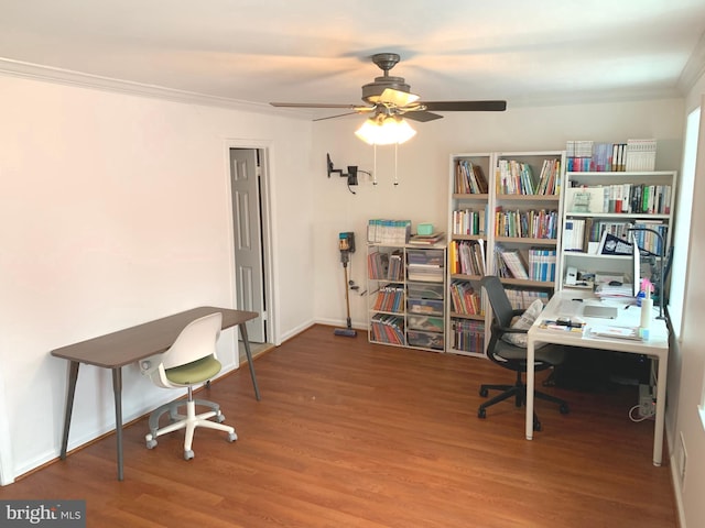 office space with ornamental molding, ceiling fan, and wood finished floors