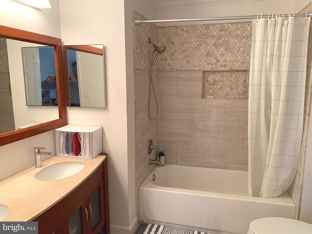 full bath featuring shower / tub combo with curtain, toilet, and vanity