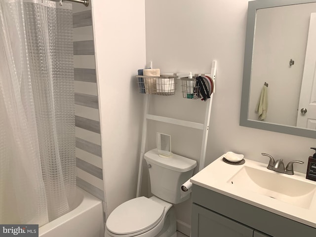 full bathroom with shower / tub combo, vanity, and toilet