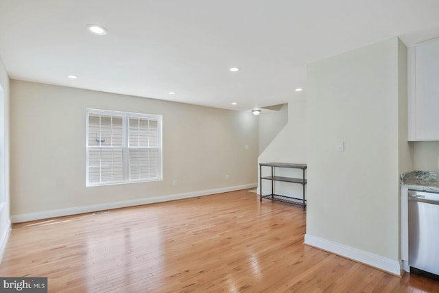 interior space with recessed lighting, baseboards, and light wood-style flooring