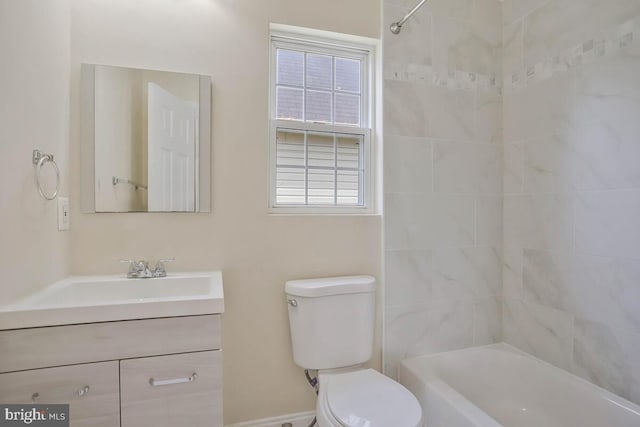 bathroom featuring vanity, shower / bathtub combination, and toilet