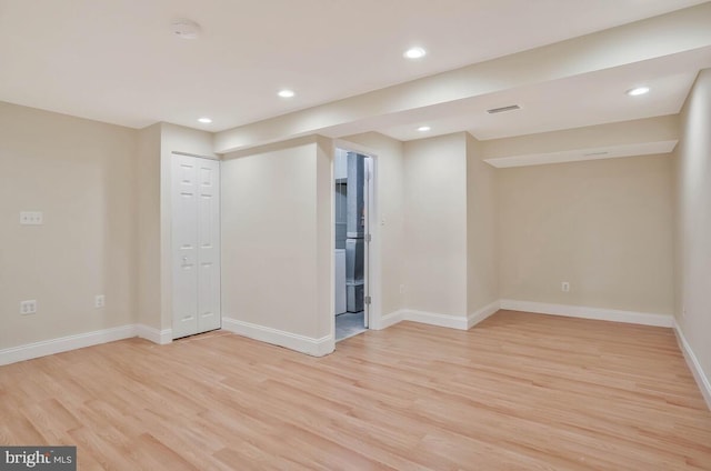 unfurnished room with recessed lighting, baseboards, and light wood finished floors