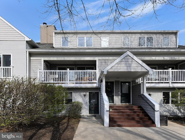 23 Academy Ct, Pennington, NJ 08534 - view of front of home featuring a chimney and a balcony