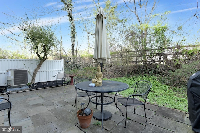 23 Academy Ct, Pennington, NJ 08534 - view of patio / terrace featuring outdoor dining space, central AC unit, and a fenced backyard