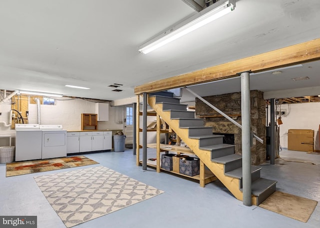 below grade area featuring separate washer and dryer and stairway