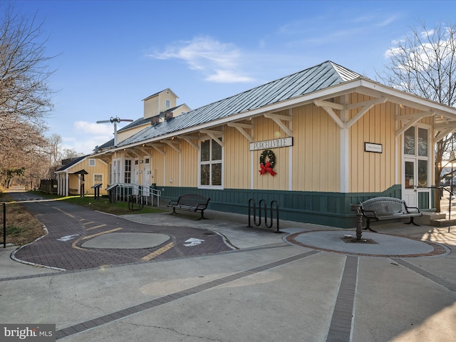 exterior space with metal roof