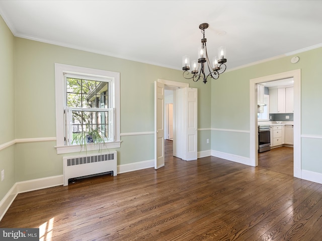 unfurnished dining area with dark wood-style flooring, an inviting chandelier, radiator, baseboards, and ornamental molding