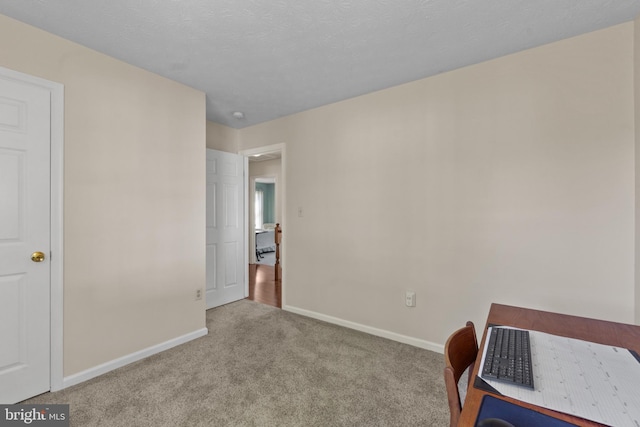 bedroom with carpet floors and baseboards