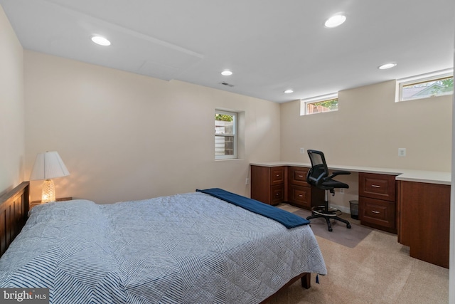 bedroom with recessed lighting and light colored carpet