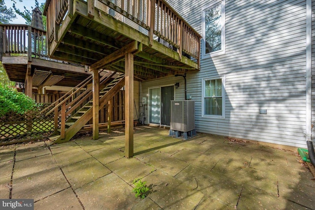 view of patio / terrace featuring stairway, a deck, and central AC