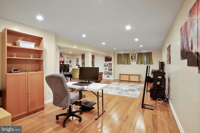 office area with baseboards, light wood-type flooring, and recessed lighting