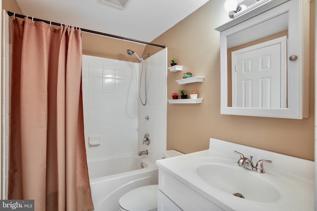 full bath with visible vents, shower / bath combination with curtain, toilet, and vanity