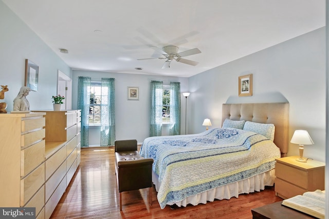 bedroom with wood finished floors and a ceiling fan