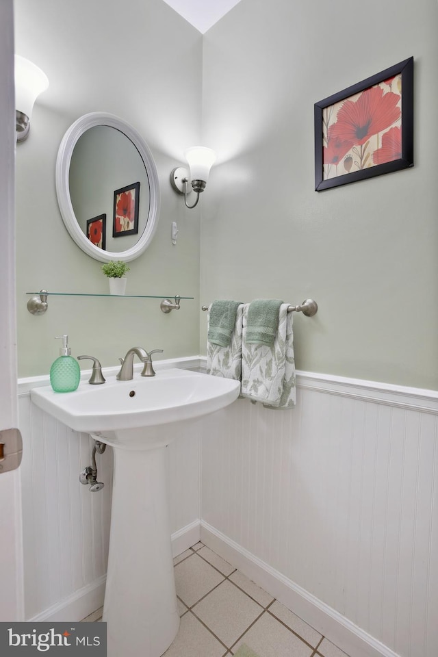 bathroom featuring wainscoting and tile patterned floors