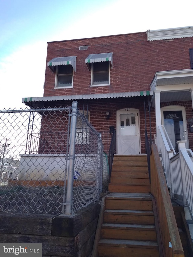 515 Wood St, Baltimore, MD 21225 - multi unit property with brick siding and fence