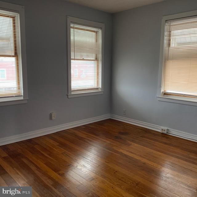 515 Wood St, Baltimore, MD 21225 - unfurnished room featuring hardwood / wood-style floors and baseboards