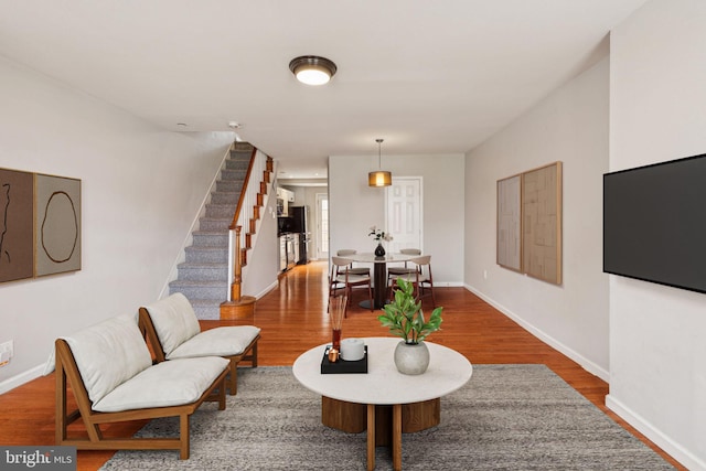 1720 Alter St, Philadelphia, PA 19146 - living room featuring stairway, baseboards, and wood finished floors