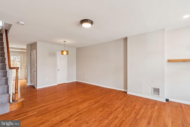 1720 Alter St, Philadelphia, PA 19146 - spare room with baseboards, light wood-type flooring, visible vents, and stairs