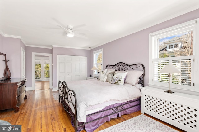 3915 Aspen St, Chevy Chase, MD 20815 - bedroom with crown molding, wood finished floors, a closet, and multiple windows
